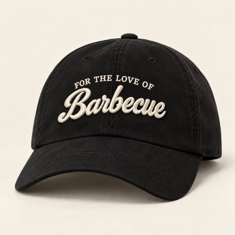Black Sueded Cap in black with warm cream embroidery, front view with FOR THE LOVE OF above Barbecue