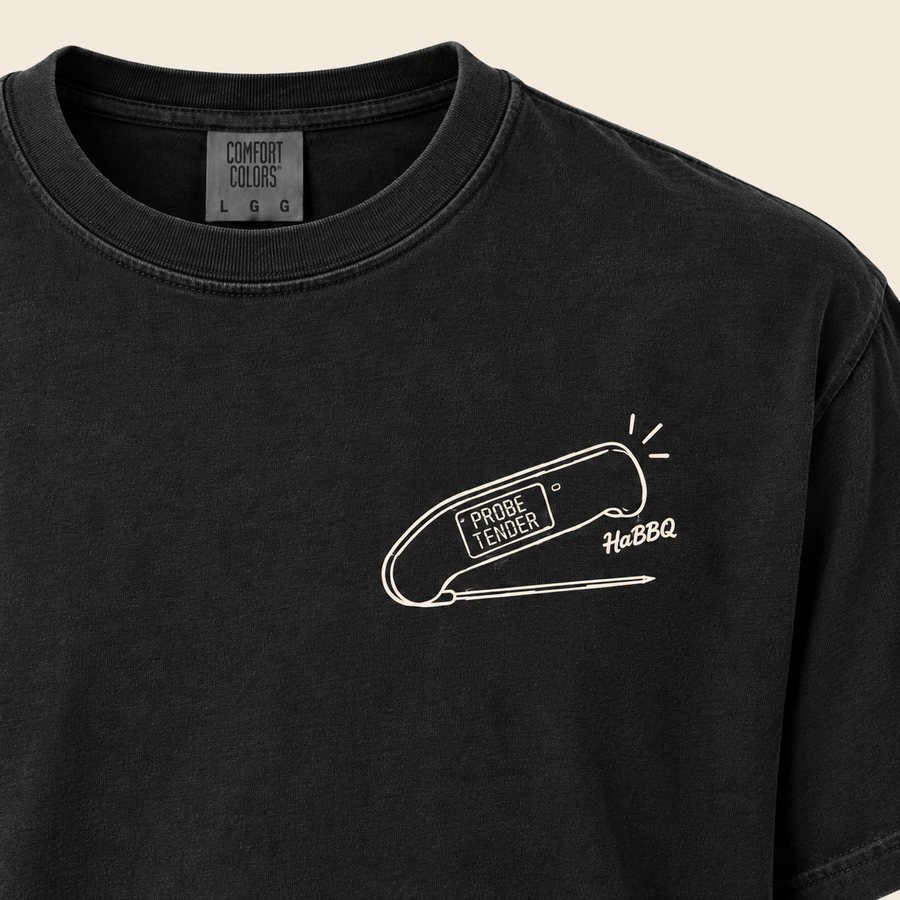 Close up of the Probe Tender thermometer graphic printed on the chest of a black HaBBQ tee